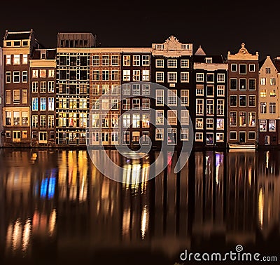 Beautiful traditional old buildings at night with reflection Stock Photo