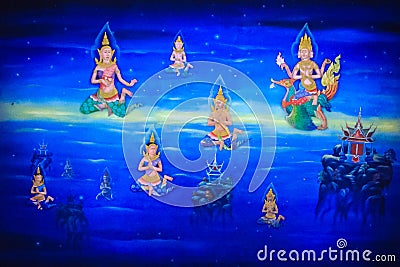 Beautiful traditional Thai style angels painting of folk literature on the ceiling at public Buddhist temple in Thailand. Stock Photo