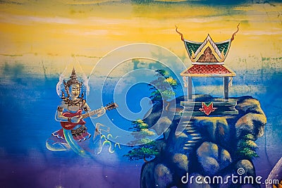 Beautiful traditional Thai style angels painting of folk literature on the ceiling at public Buddhist temple in Thailand. Stock Photo