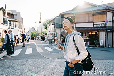 Beautiful traveler crossing the road Stock Photo