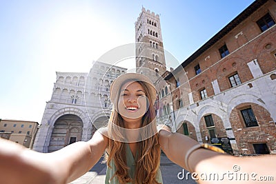 Beautiful traveler girl takes selfie photo in Lucca, Tuscany, Italy Stock Photo