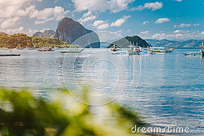 Beautiful tropical scenery. El-Nido, Philippines. Banca boats resting on tranquil early morning at Corong Corong lagoon. Stock Photo