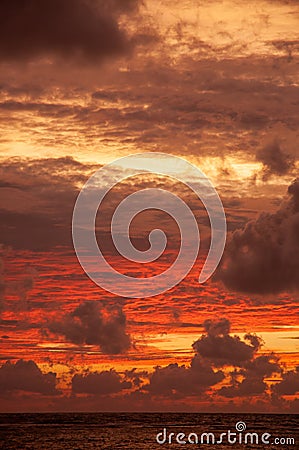 Beautiful tropical sunset with vibrant warm colours Stock Photo