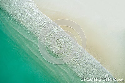 Beautiful tropical white empty beach and sea waves seen from above. Maldives beach aerial view. Top view from drone Stock Photo