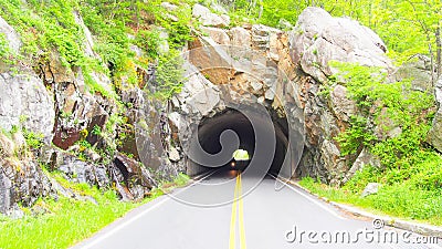 Motorcyclist coming out of a tunnel, Shenandoah National Park, Skyline Stock Photo