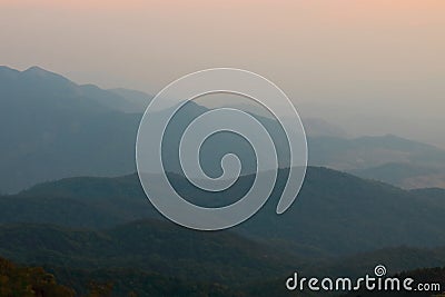 Beautiful twilight layers of silhouettes mountain in Chiang Mai , Thailand Stock Photo