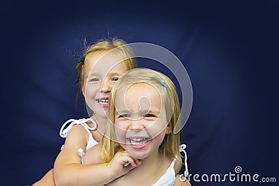 Beautiful twin little girls smiling Stock Photo