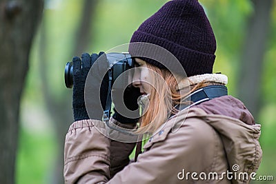 Beautiful twoman tourist travel photographer photographing forest at autumn day Stock Photo