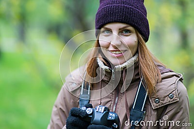 Beautiful twoman tourist travel photographer photographing forest at autumn day Stock Photo