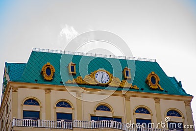 Beautiful and unusual clock on the roof of the building in the city of Batumi Stock Photo