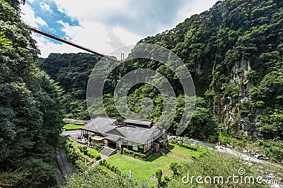 Beautiful valley and japanese house in Kamikawa Otaki Waterfall Stock Photo