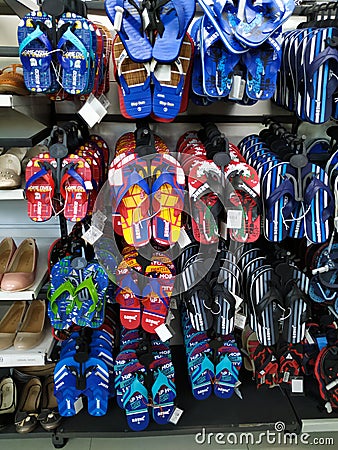 Beautiful view of Adult Slippers hanging in a Slipper Stand at the Vishal Market or Mall Editorial Stock Photo