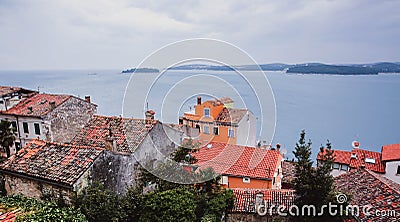 Beautiful view of the ancient city, the island and the sea on which the ship sails. Rovinj, Istria, Croatia Stock Photo