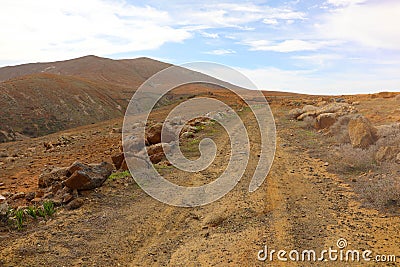 Beautiful view of an arid pathway with hills in Fuerteventura, Canary Islands Stock Photo