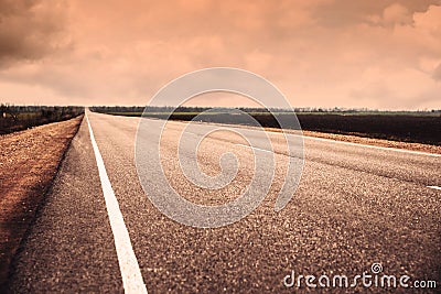 View of asphalt highway without transport. Orange tone Stock Photo