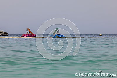 Beautiful view of Atlantic Ocean with beach and water attractions where people enjoy riding catamarans. Editorial Stock Photo