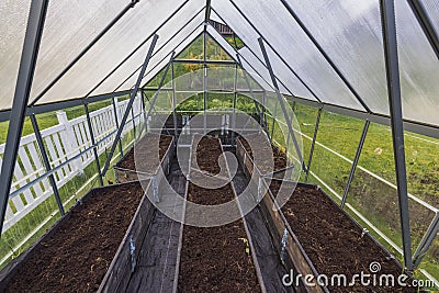 Beautiful view of autumn interior of greenhouse after harvest and prepared for winter period. Stock Photo