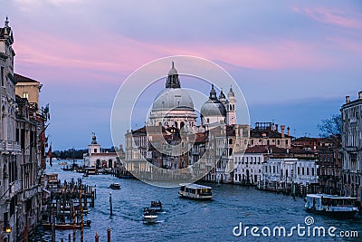 Beautiful view on Basilica di Santa Maria della Salute in golden evening light at sunset in Venice, Italy Editorial Stock Photo