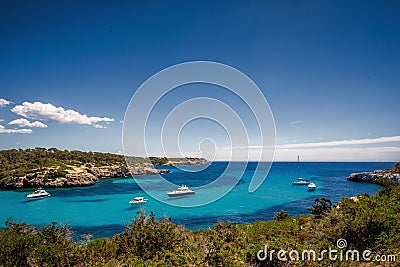 Beautiful view of the bay with turquoise water and yachts in Cala Mondrago National Park on Mallorca island Stock Photo