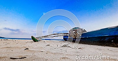 A beautiful view of a beach parked fishing boat. Stock Photo