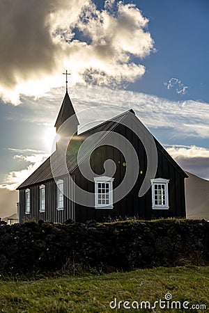 Beautiful view of a black wooden church in Budir, Iceland, vertical shot Stock Photo