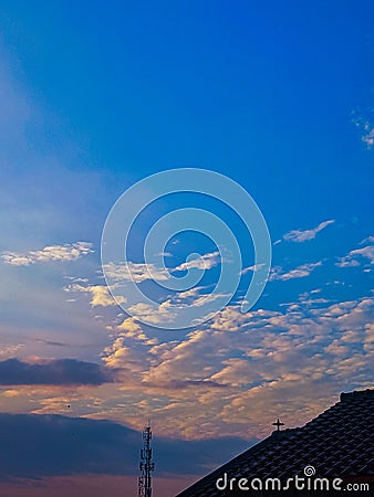 The beautiful view of the blue sky along with a collection of dark and white clouds Stock Photo