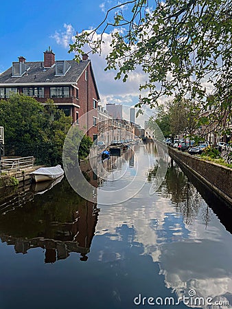 Beautiful view of buildings near canal with moored boats in city Stock Photo