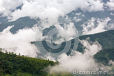 Beautiful view of clouds slowly rising in the morning in the mountains of Vietnam highlands Stock Photo