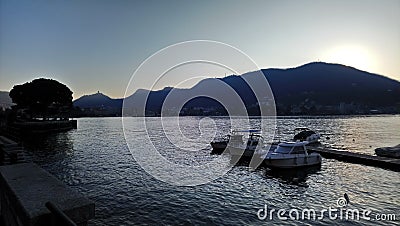 Beautiful view on como lake, Italy, sunset, boat, mountains Editorial Stock Photo