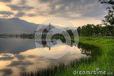 Beautiful view of Darul Quran Mosque with reflections during sunrise Stock Photo