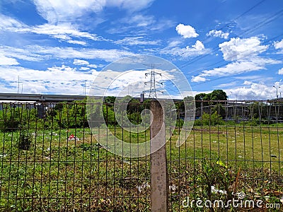 He beautiful view of an empty land with bright sky at East Jakarta, Jakarta 2020 Stock Photo