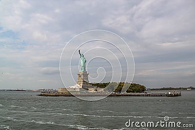 Beautiful view of famous Statue of Liberty and Manhattan on background. Liberty Island in New York Harbor in New York Stock Photo