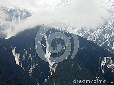 Beautiful View Of Foggy Landscape On a Wet Afternoon In Gulmarg, Jammu And Kashmir, India. Stock Photo