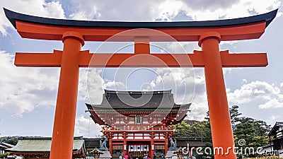 Beautiful view of the Fushimi Inari Shrine in Kyoto, Japan, framed in a red door Editorial Stock Photo