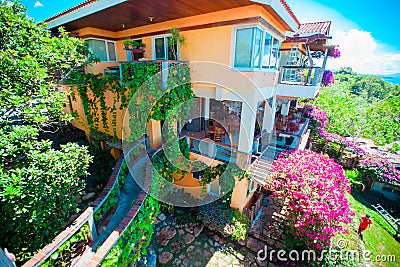 Beautiful view of the garden and cozy little hotel in tropical island Stock Photo