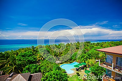 Beautiful view of the garden and swimming pool in a cozy little hotel Stock Photo