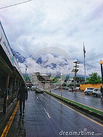 Beautiful view of Gilgit city after rain, clouds on mountains, wet road after rain, Gilgit Baltistan, 15th April 2023. Editorial Stock Photo