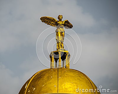 Beautiful view of a golden statue of an angel with wings at the entrance of a hotel in Alanya Editorial Stock Photo