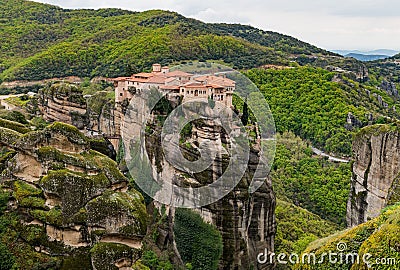 Beautiful view of green mountains and the Holy Trinity complex in Meteora. Kalabaka, Greece. Stock Photo