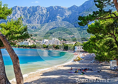 A beautiful view of Makarska beach through the pines Editorial Stock Photo