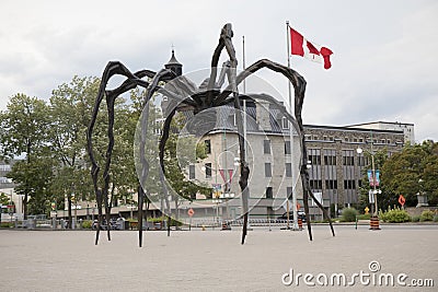 Beautiful view of the Maman bronze sculpture near the Notre Dame Cathedral Basilica in Ottawa Editorial Stock Photo