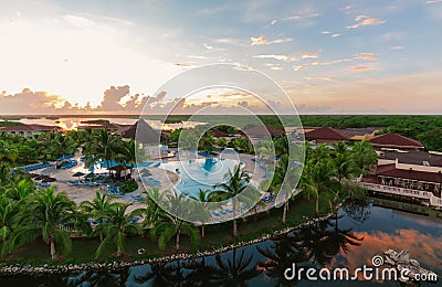 Beautiful view of Memories Caribe resort grounds, buildings and tropical garden on early morning sunrise time Editorial Stock Photo