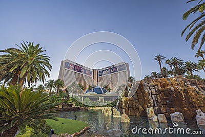 Beautiful view of The Mirage casino hotel with a pond and tropical trees. Editorial Stock Photo