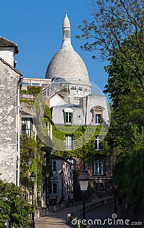 Beautiful view of Montmartre street and the Sacre-Coeur basilica in the background, France. Stock Photo