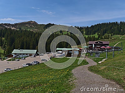 Mountain guesthouse BerghÃ¼tte Grasgehren, located near Riedberg mountain pass in the AllgÃ¤u Alps with Riedberger Horn peak. Editorial Stock Photo