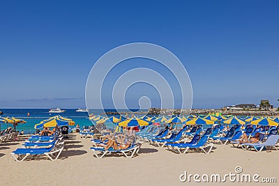 Beautiful view of people on sandy beach on sunny summer day. Gran Canary. Spain Editorial Stock Photo