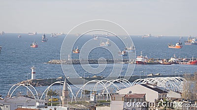 Beautiful view of pier with many ships in sea. Action. Large ships sail at suburban sea pier on sunny day. Fishing and Editorial Stock Photo