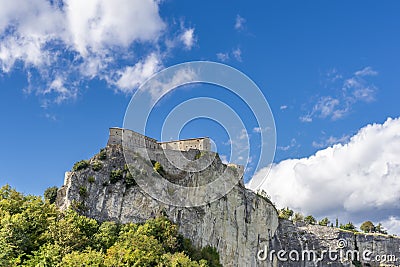 Beautiful view of the rock spur on which the fortress of San Leo stands, Rimini, Italy, on a sunny day Stock Photo