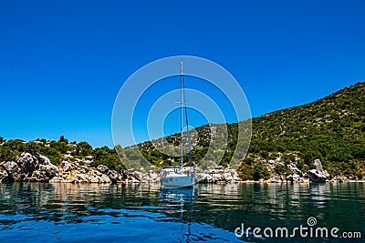 Beautiful view of a sailboat anchored in Peristera island near the famous Shipwreck of Peristera, Alonissos, Greece Editorial Stock Photo