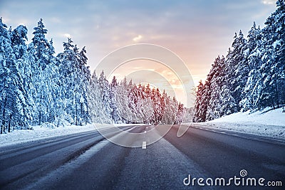 Beautiful view of the snowy curve country road in winter Stock Photo